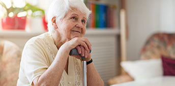 Elderly Woman Listening To Conversation